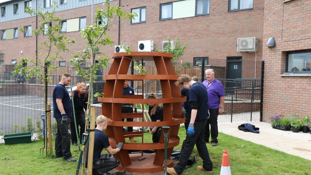 RBH apprentices install a new planter at the Strand Hub
