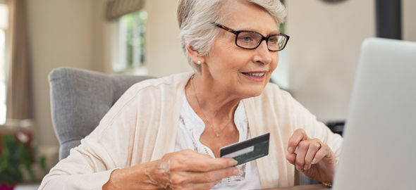 Old Woman Paying Bills Online J745CDU