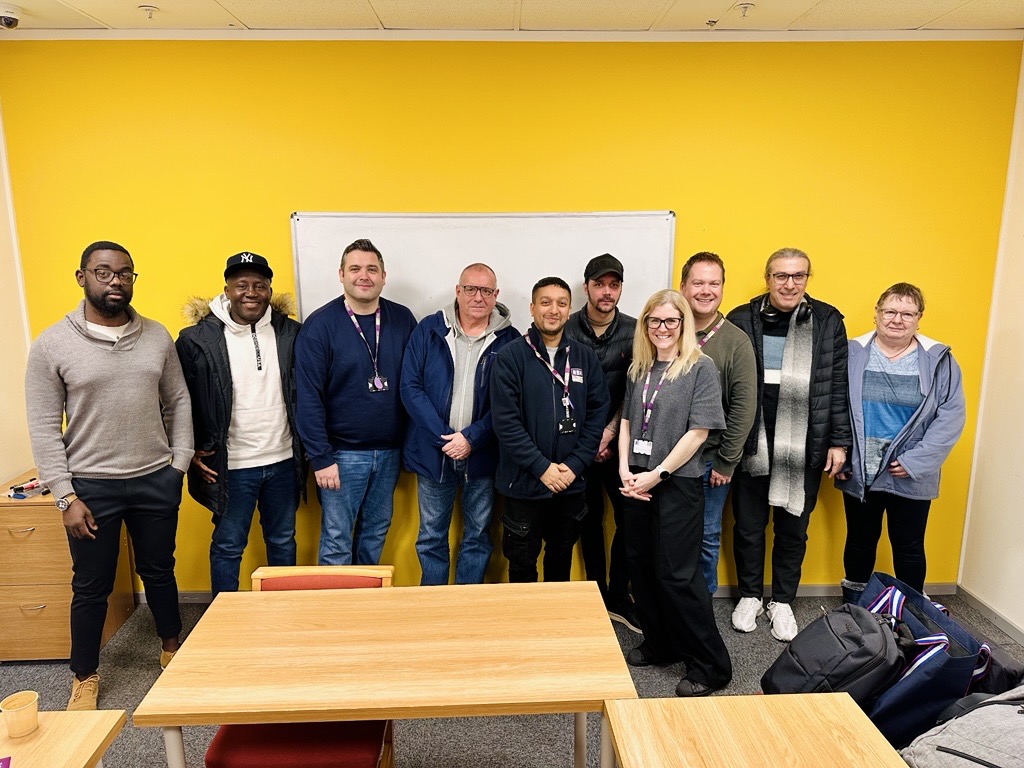 Group photo of customers and colleagues at the Lighthouse Project