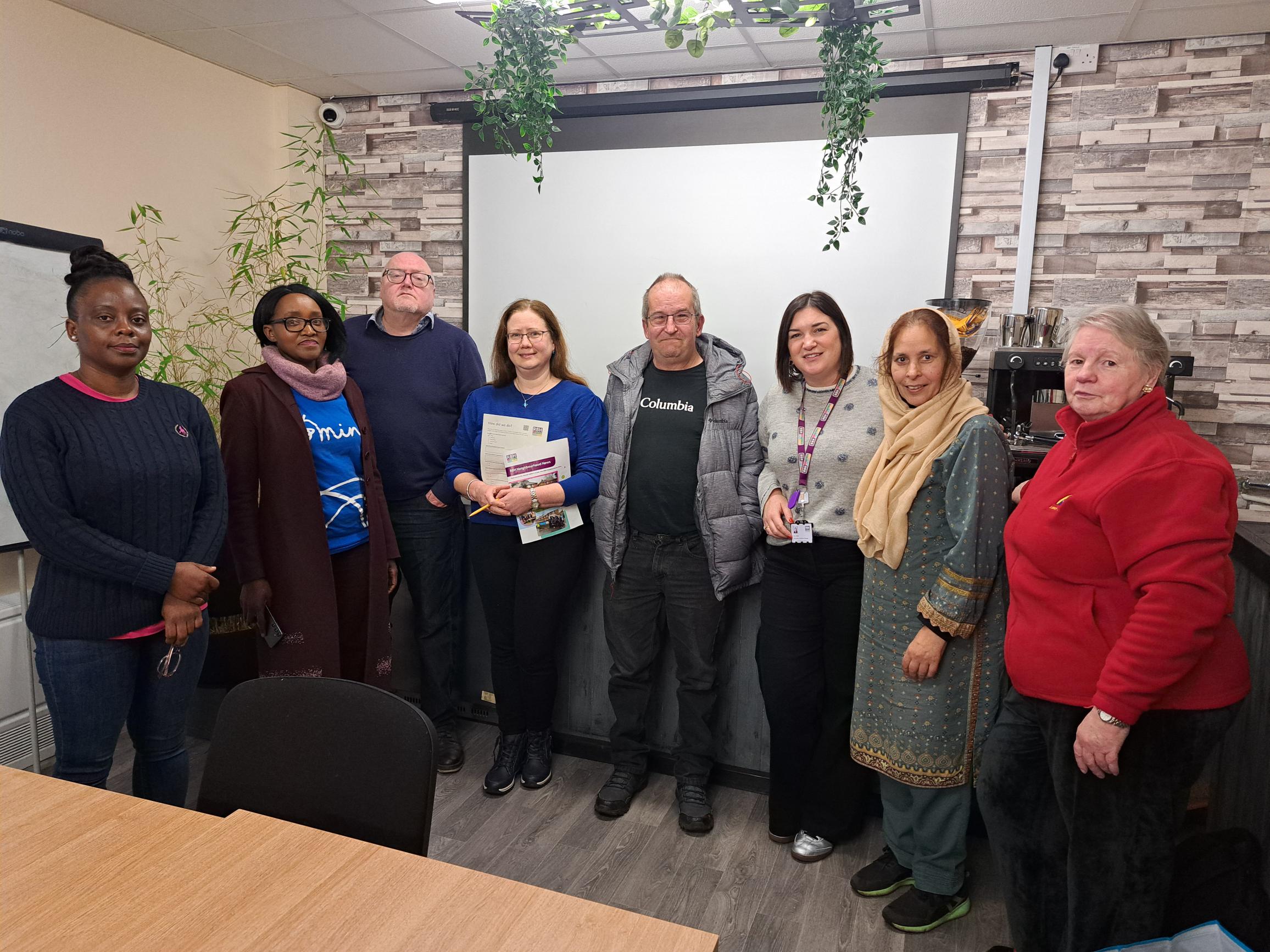 Group photo of customers and colleagues at Spotland Community Centre
